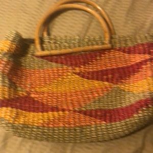 Straw purse with wooden handles